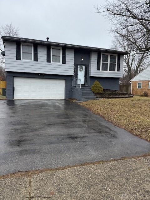 split foyer home featuring a garage