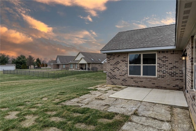 2220 Tandem Dr, Xenia, OH 45385 - yard at dusk with a patio area