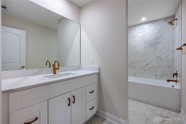 2220 Tandem Dr, Xenia, OH 45385 - bathroom featuring vanity and tiled shower / bath combo