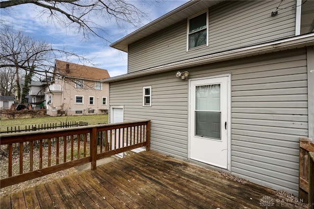 wooden terrace with a yard