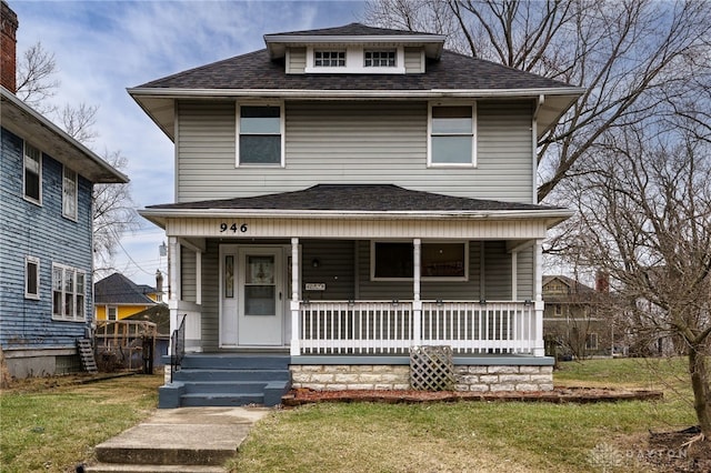 view of front of home with a porch and a front lawn