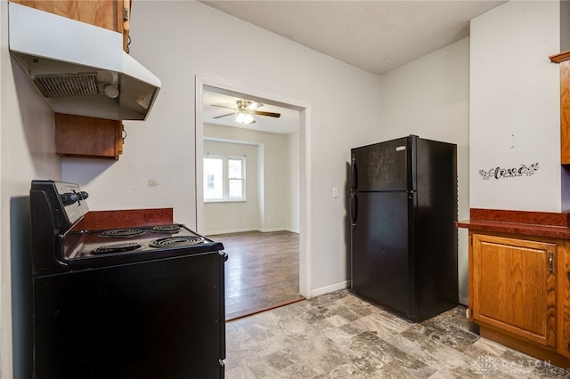 kitchen with ceiling fan and black appliances