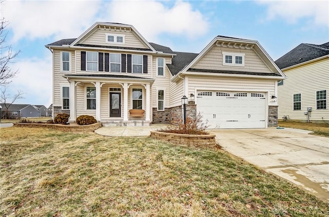 craftsman inspired home with a front lawn and covered porch