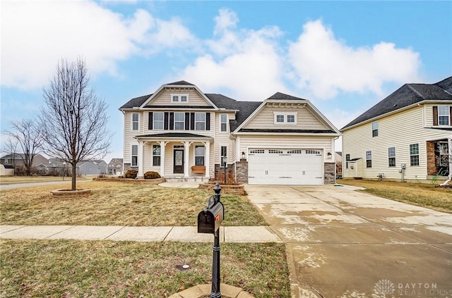 craftsman-style home with a garage, covered porch, and a front lawn