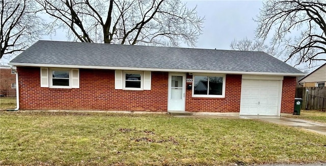 single story home featuring a garage and a front yard