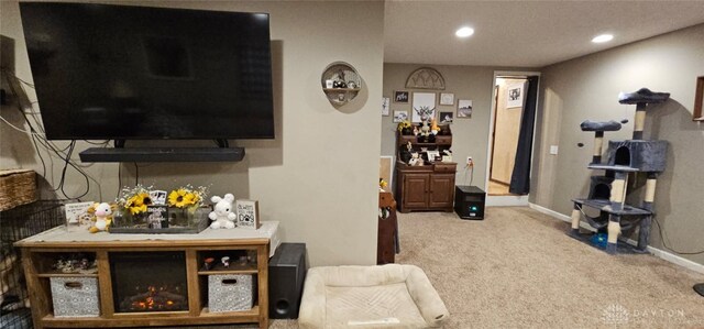 living area with baseboards, recessed lighting, and carpet floors