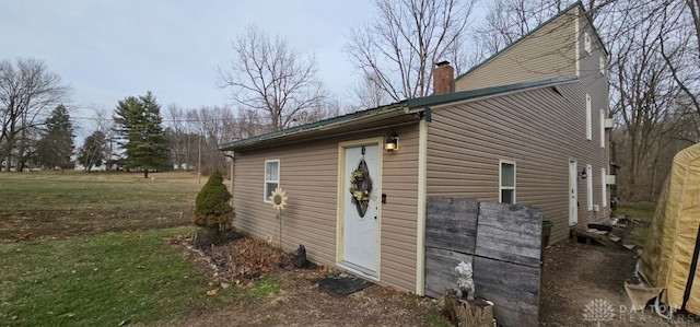 view of home's exterior with a yard