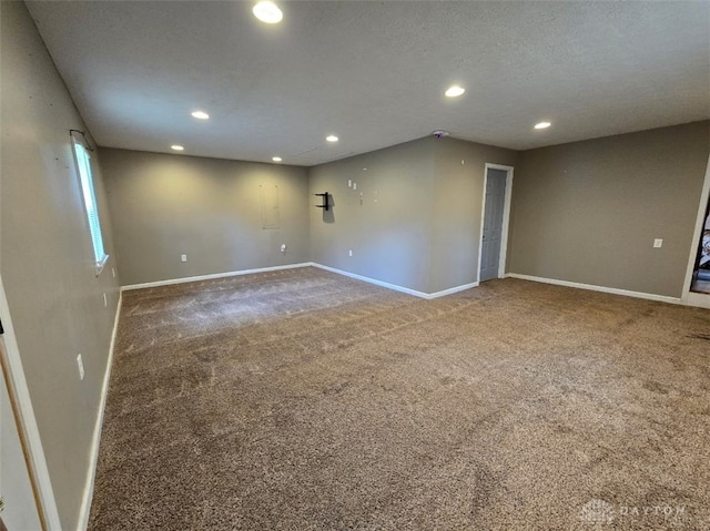 carpeted empty room with recessed lighting and baseboards