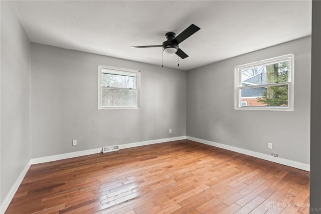 unfurnished room featuring ceiling fan and wood-type flooring