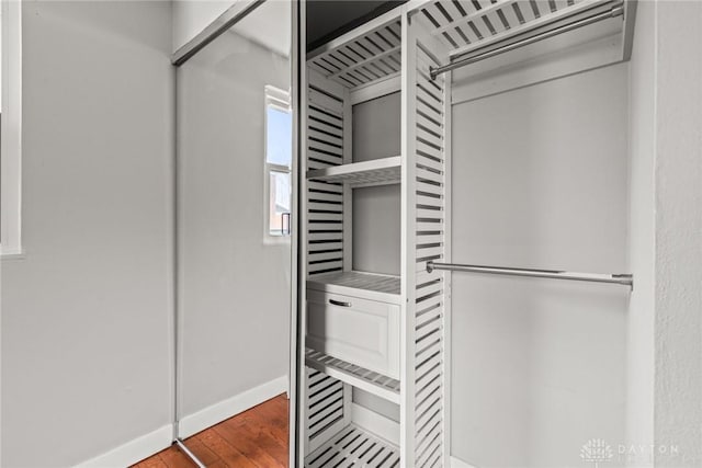 spacious closet featuring hardwood / wood-style floors