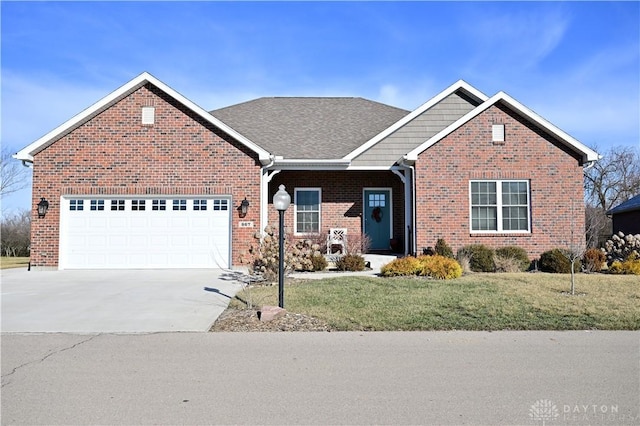 view of front of home with a garage and a front lawn