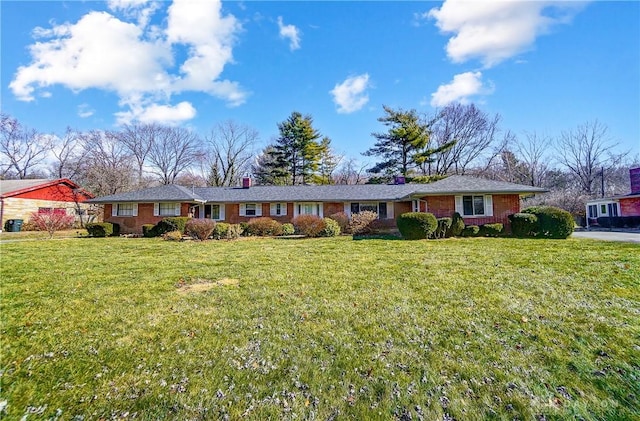 ranch-style house with a front lawn