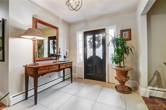 tiled foyer featuring ornamental molding and a baseboard radiator