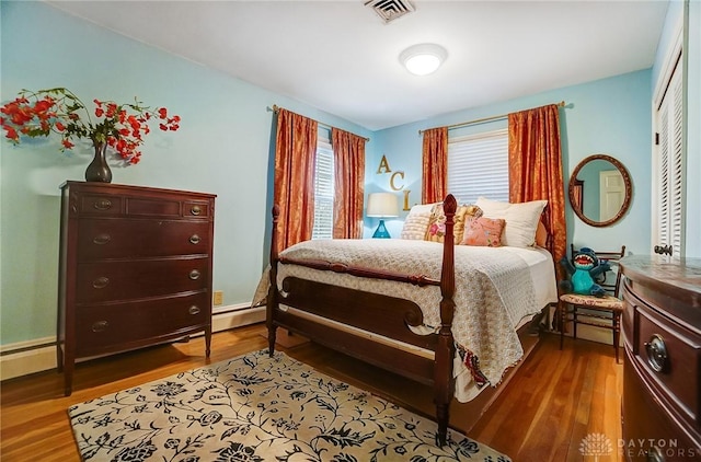 bedroom with wood-type flooring