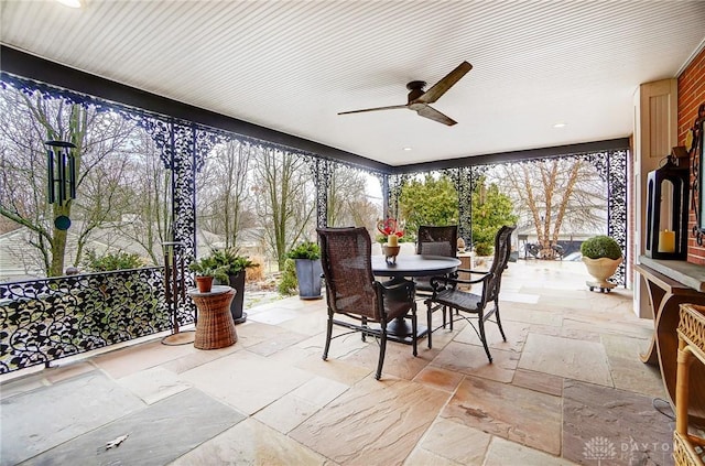 sunroom / solarium with ceiling fan