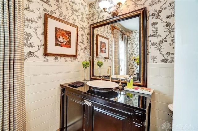 bathroom with tile walls and vanity