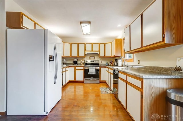 kitchen with sink, light hardwood / wood-style flooring, white cabinetry, white refrigerator with ice dispenser, and stainless steel electric range oven