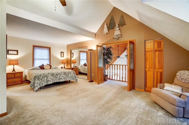 carpeted bedroom with multiple windows, vaulted ceiling, and ceiling fan