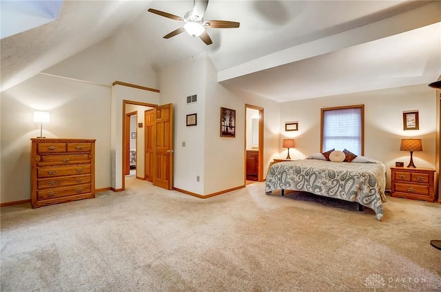 bedroom featuring ceiling fan, ensuite bathroom, carpet flooring, and vaulted ceiling