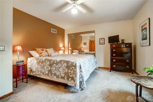 carpeted bedroom with a closet and ceiling fan