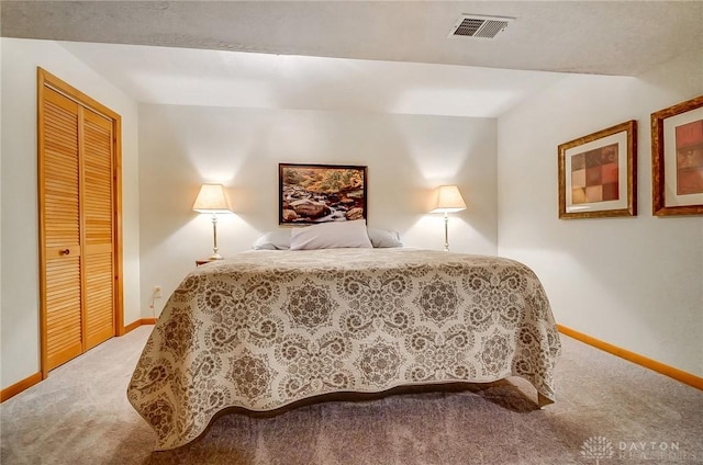 carpeted bedroom with a closet