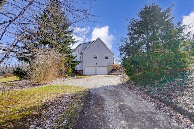 view of home's exterior with a garage