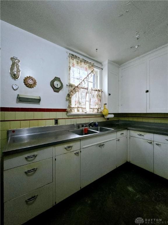 kitchen with sink and white cabinets