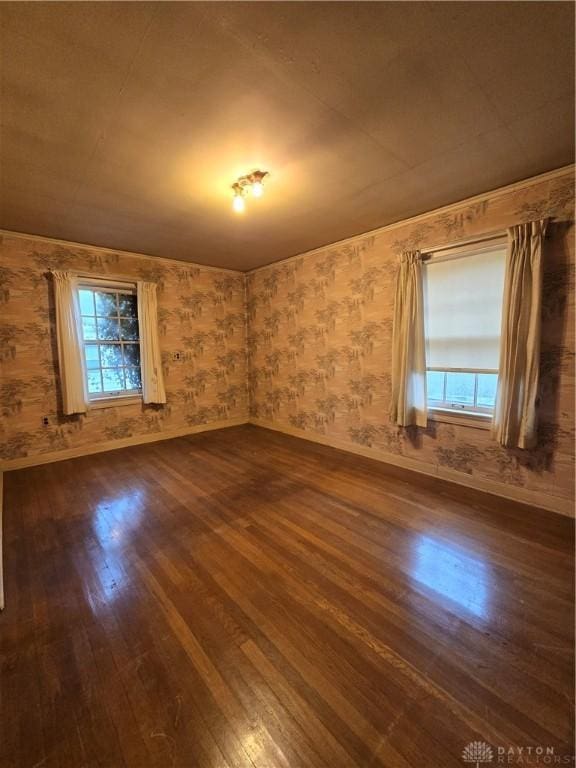 empty room with dark hardwood / wood-style floors