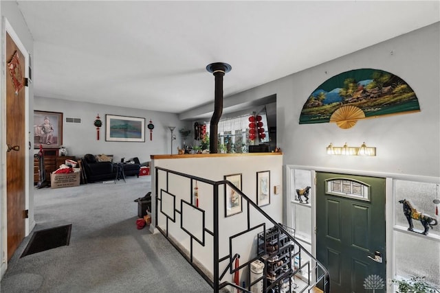 view of carpeted foyer