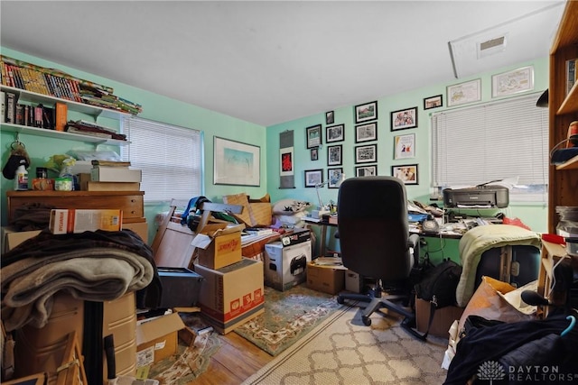 office space with light hardwood / wood-style floors