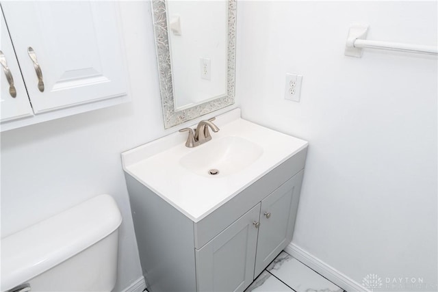 bathroom featuring vanity and toilet