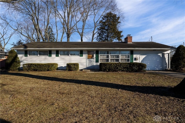 single story home featuring a garage