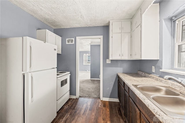 kitchen with dark brown cabinets, white appliances, white cabinets, dark hardwood / wood-style flooring, and sink