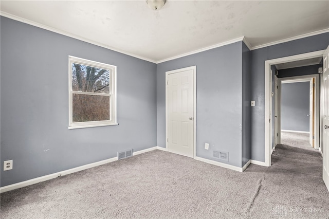 unfurnished bedroom featuring ornamental molding and carpet flooring