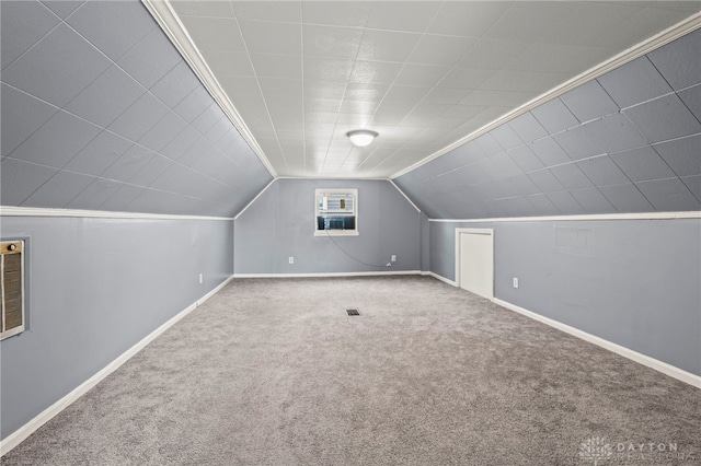 bonus room featuring vaulted ceiling and carpet