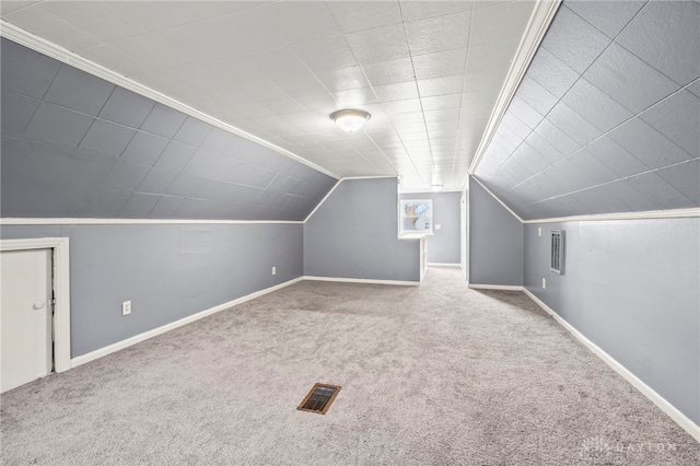 additional living space with light carpet and lofted ceiling