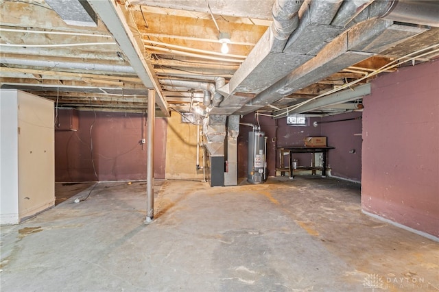 basement featuring heating unit and gas water heater