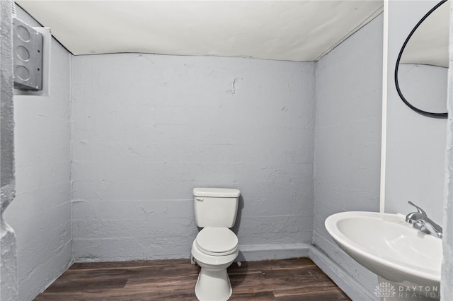 bathroom featuring sink, toilet, and hardwood / wood-style floors