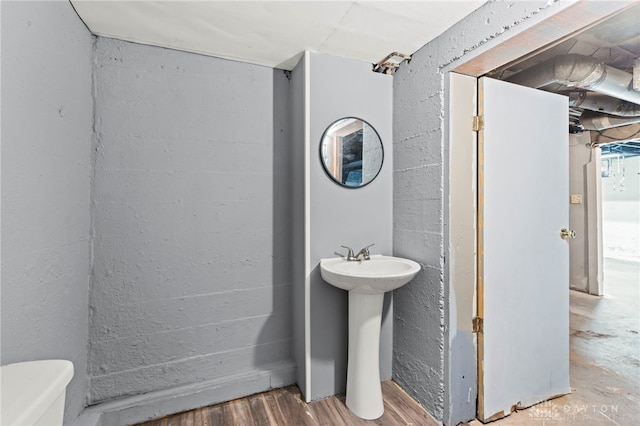 bathroom featuring toilet and hardwood / wood-style floors