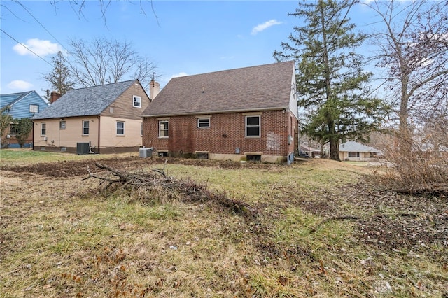 back of property featuring central AC