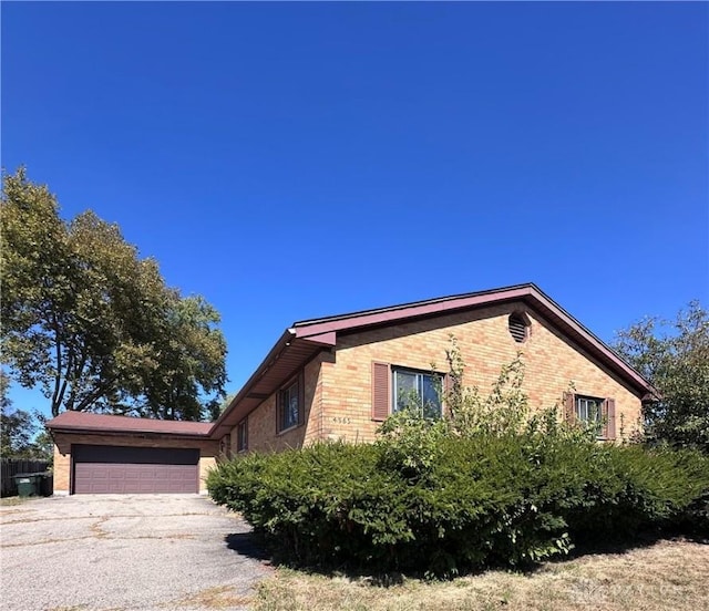 view of side of property featuring a garage