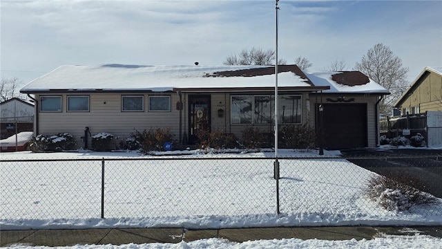 ranch-style home featuring a garage