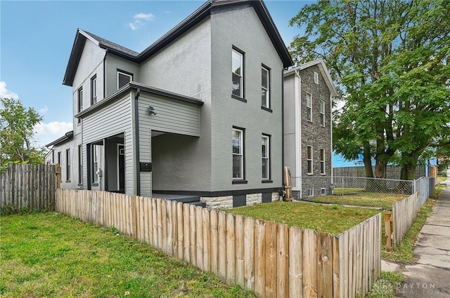 view of home's exterior featuring a lawn