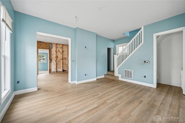 unfurnished living room with light wood-type flooring