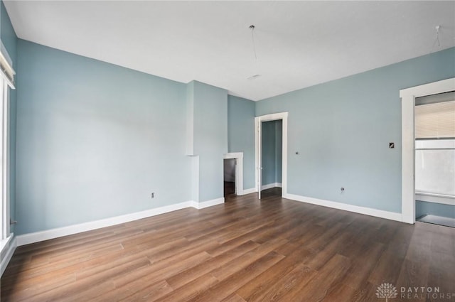 unfurnished living room featuring hardwood / wood-style floors