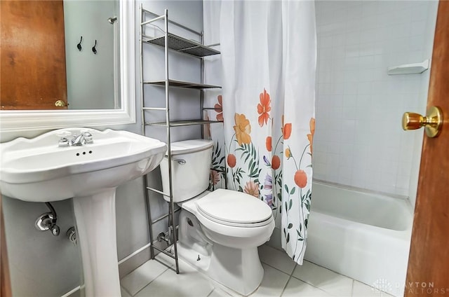 bathroom with tile patterned floors, toilet, and shower / bath combo