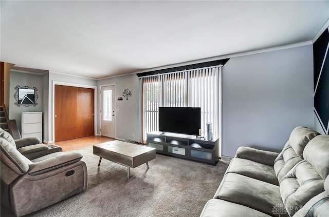 carpeted living room with ornamental molding