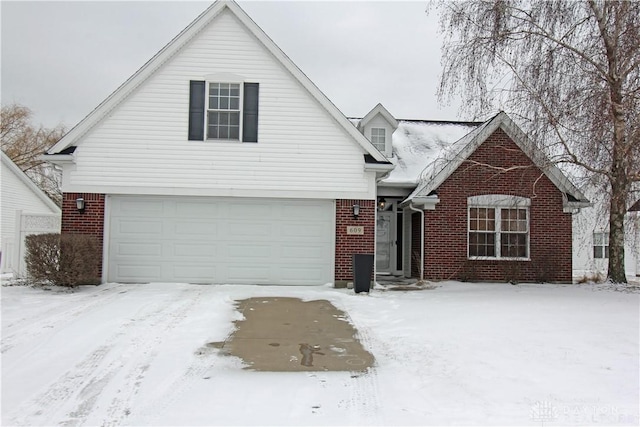 view of front of home featuring a garage and brick siding