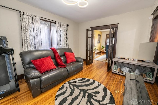 living room featuring french doors and hardwood / wood-style flooring