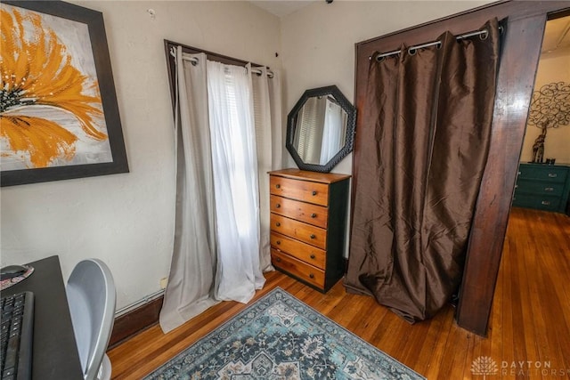 bedroom with hardwood / wood-style flooring